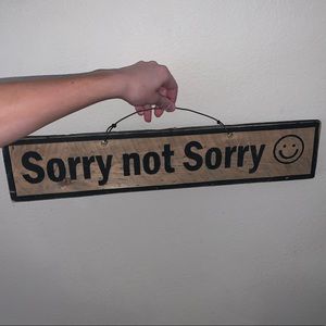 “sorry not sorry” wooden sign
